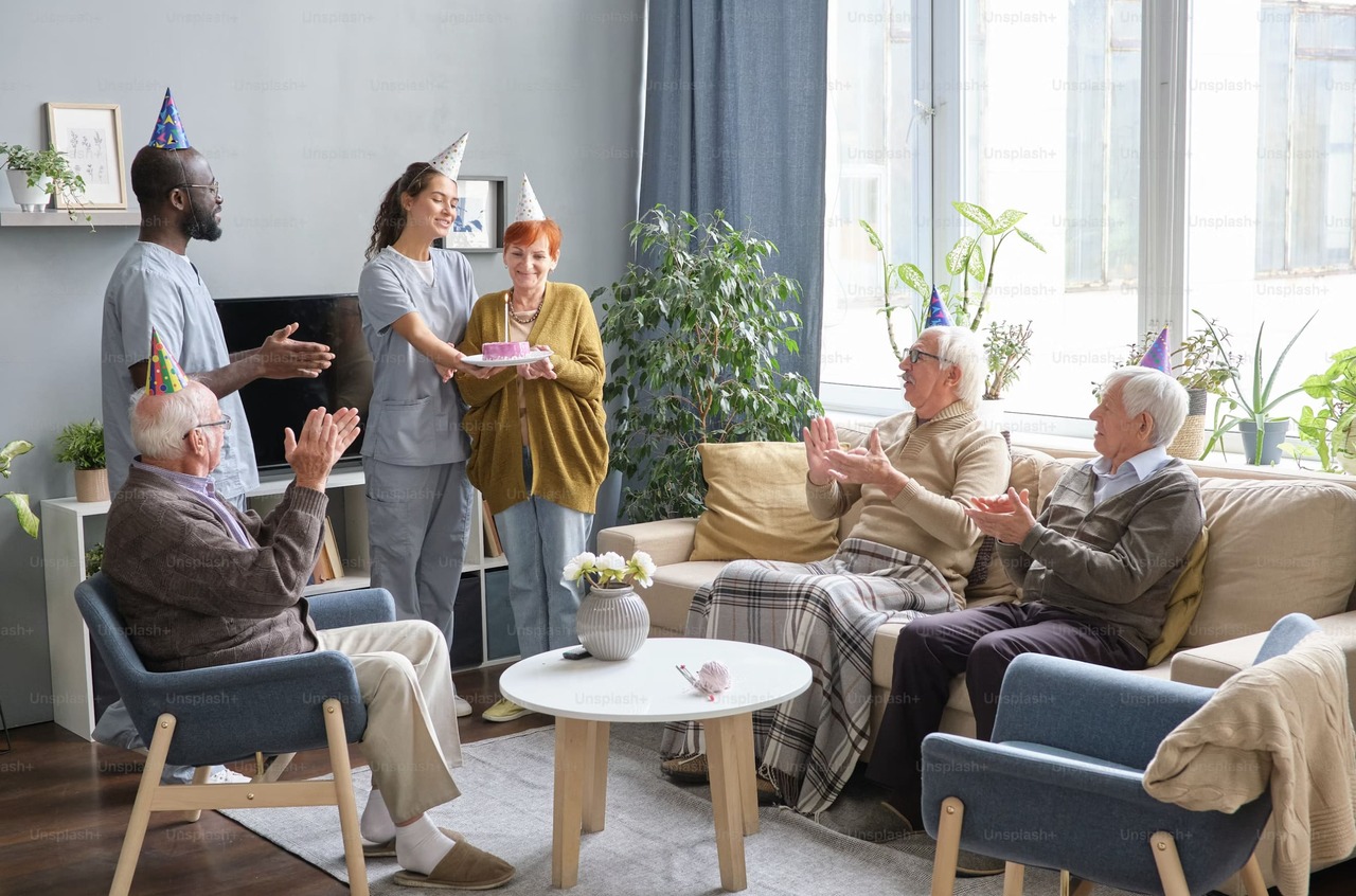 Caregiver supporting a senior client in a comfortable home setting